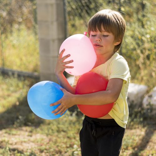 medium-shot-kids-holding-balloons